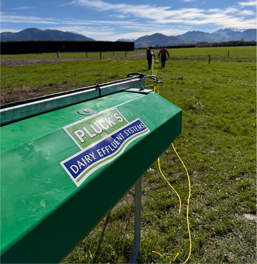 Untitled design Plucks Engineering concrete effluent storage pond on a New Zealand dairy farm with Canterbury plains and Southern Alps in the background