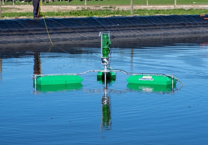 Plucks Engineering SM Posts-2 Plucks floating effluent pond stirrer running in a lined dairy effluent pond on a Canterbury farm