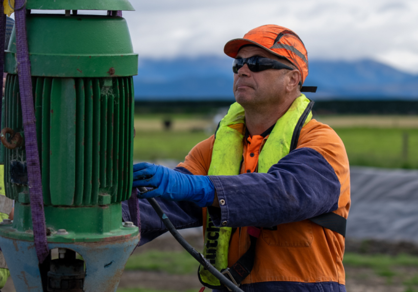 Plucks Engineering technician installing an effluent pond stirrer on a Canterbury dairy farm
