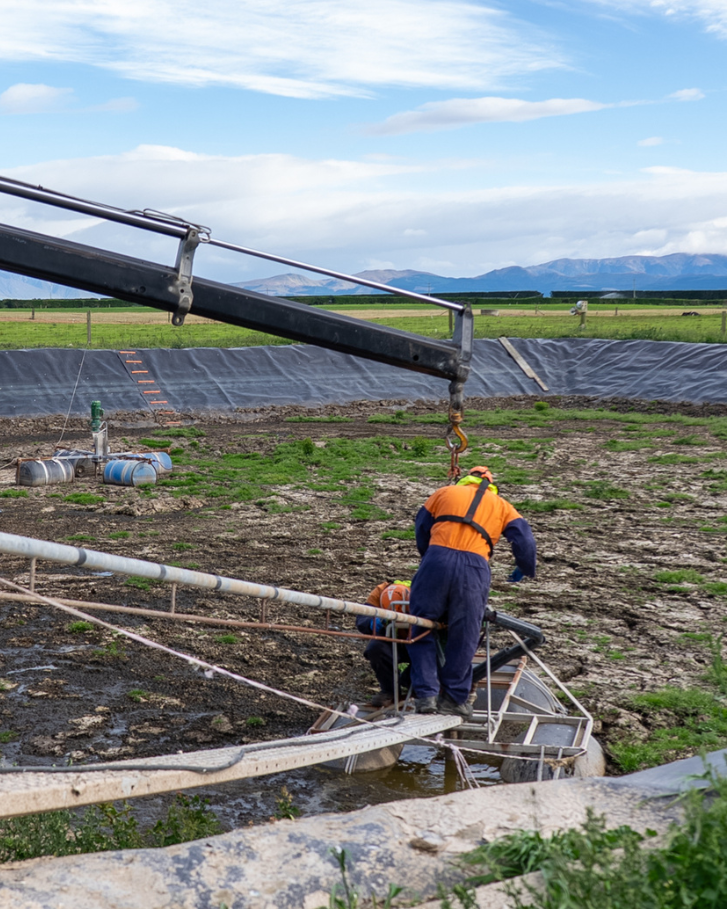 Plucks Engineering team installing dairy effluent pond equipment on a Canterbury farm