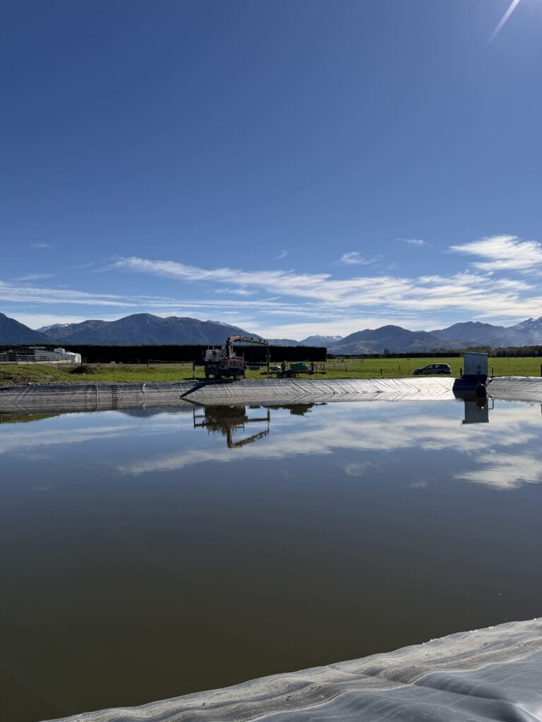 Dairy effluent pond with surface aerator on a New Zealand farm